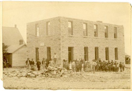 August Zeckser and his crew constructed the St. John Lutheran School in the summer of 1890 and are seen here with a group of onlookers. The masonry work for the new building cost $895.60. Photo Courtesy St. John Lutheran Church.