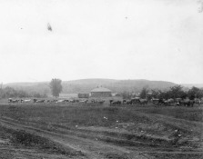 Gus Meier photographed a funeral procession entering Alma from the south. Visible in the background is the first CRIP depot which burned to the ground on August 31, 1900. Photo courtesy Emmett Burleson.