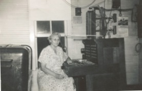 Longtime Maple Hill, Kansas operator, Mable Clark is seated at the switchboard. Photo courtesy Nick Clark.