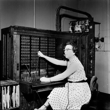 Nola Conrad, longtime telephone operator at Eskridge, Kansas is seen here connecting a call at the switchboard. Photo courtesy Kansas State Historical Society.
