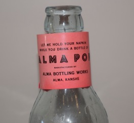 This napkin ring was a promotional or advertising item of the Alma Bottling Works, Alma, Kansas.