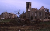 Charles Herman traveled to Topeka to photograph tornado damage from the famed 1966 storm which tore through the city. In this view one sees extensive damage to buildings on the campus of Washburn University.