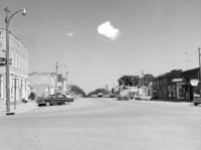 Dean Dunn took this photo of Main Street in Eskridge, looking north in about 1964. Notice that there were three new car dealerships in Eskridge at this time, the Ford dealership at the far left, the Chevrolet dealership, seen at the right, and the Plymouth dealership, located in the next block north.