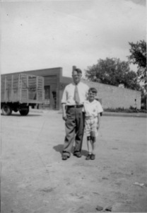 Preston Dunn, left, and Dean Dunn stand on Main Street in this view from the 1930s. Duff Produce is visible in the background.