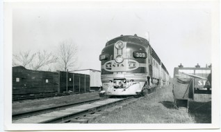 An ATSF Streamliner stops at Eskridge in this 1950s view.